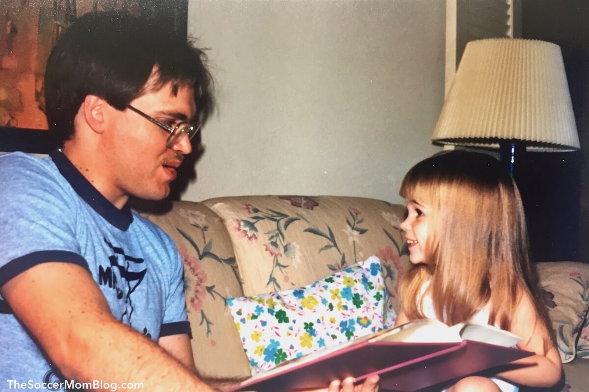 Dad reading to little girl (The Soccer Mom Blog)