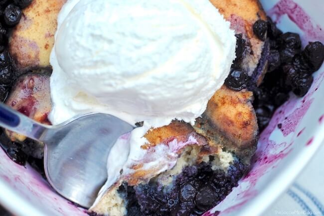 Close up of cake style blueberry cobbler in bowl