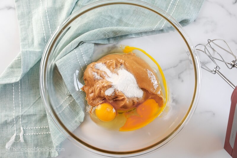 eggs, peanut butter, and sweetener in glass bowl