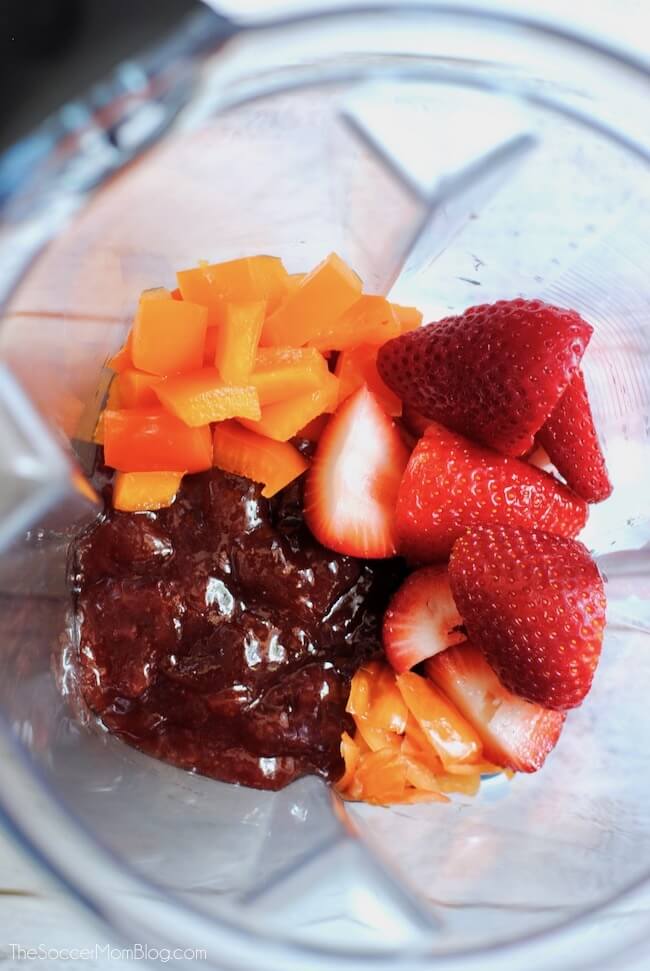 Strawberries and orange peppers in blender to make Strawberry Habanero Jam