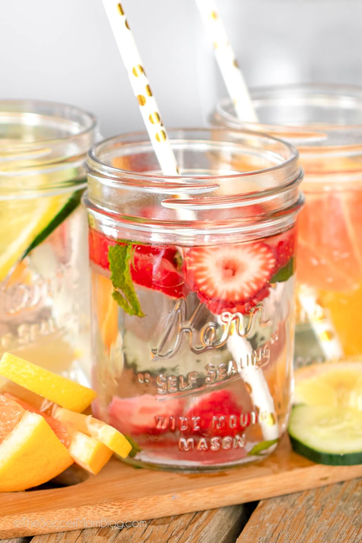close up of a jar of infused water made with strawberries.