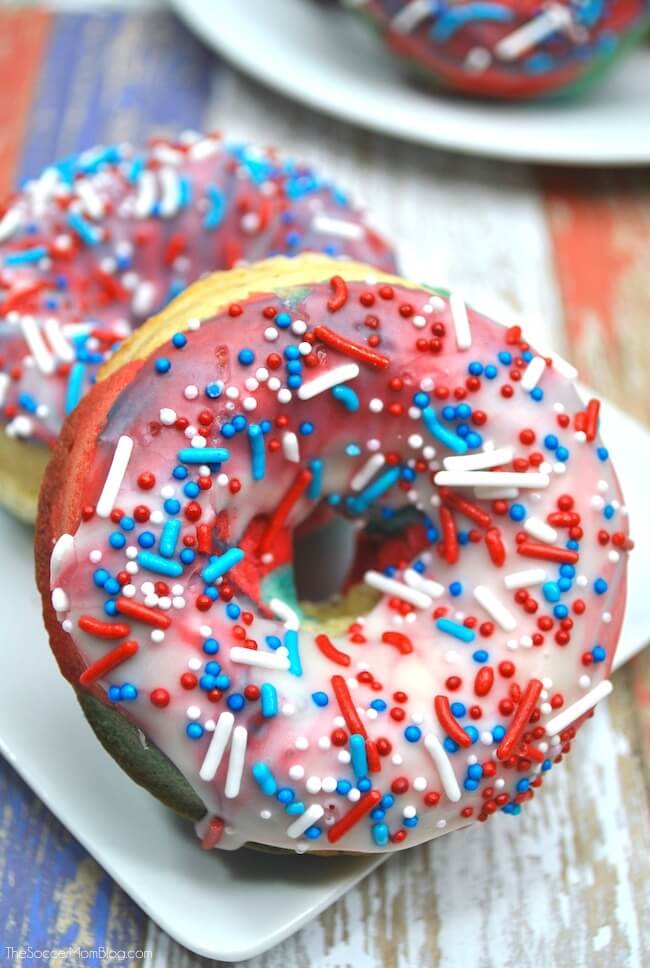 It doesn't get more patriotic than this! Red White & Blue Swirl Donuts are a true all-American treat! Perfect 4th of July party dessert! Step-by-step photo instructions inside.