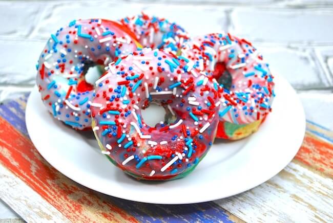 It doesn't get more patriotic than this! Red White & Blue Swirl Donuts are a true all-American treat! Perfect 4th of July party dessert! Step-by-step photo instructions inside.