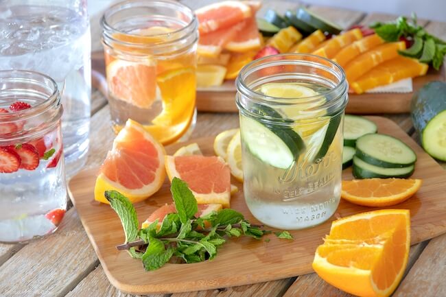 cutting fruit to make vitamin water