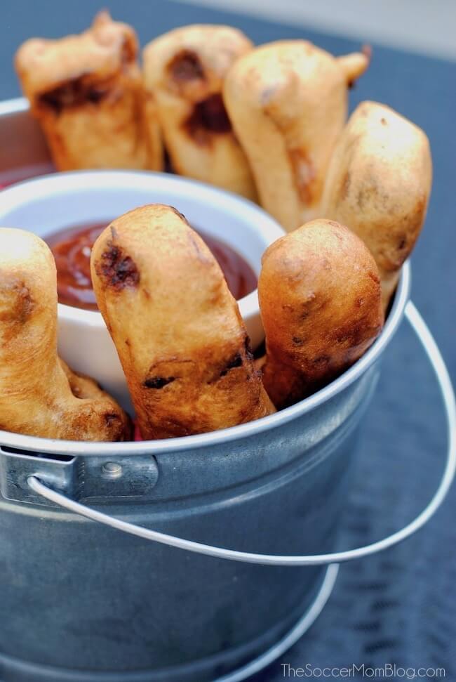 Bucket of fried rib lollipops with BBQ sauce