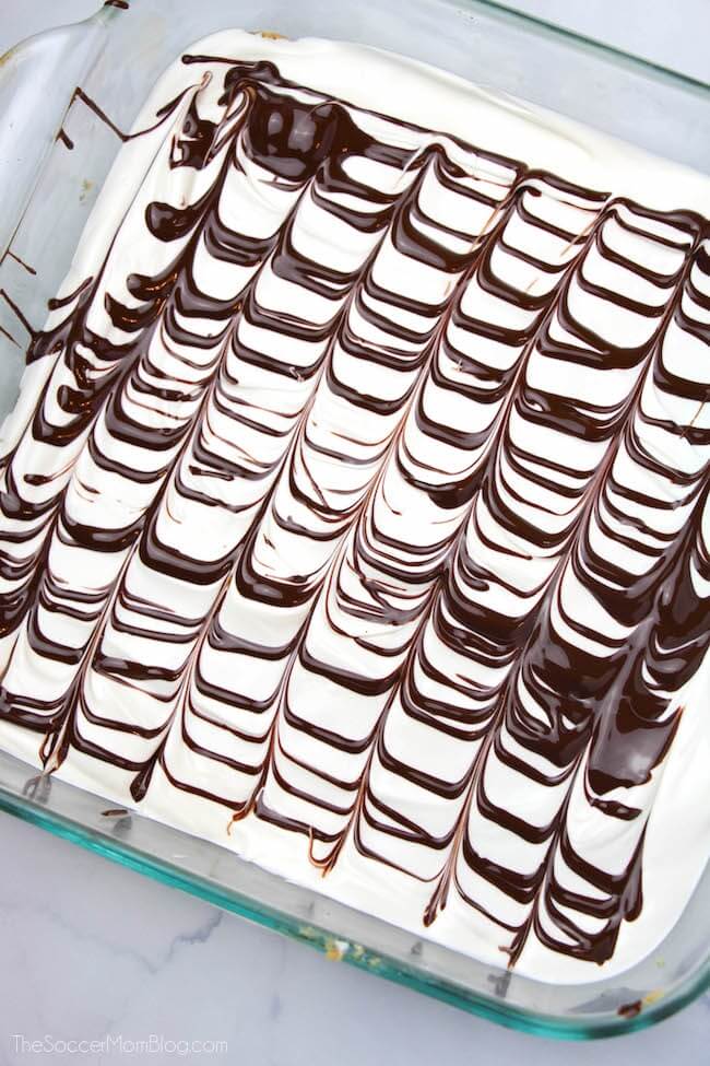 dark chocolate design on white chocolate frosting