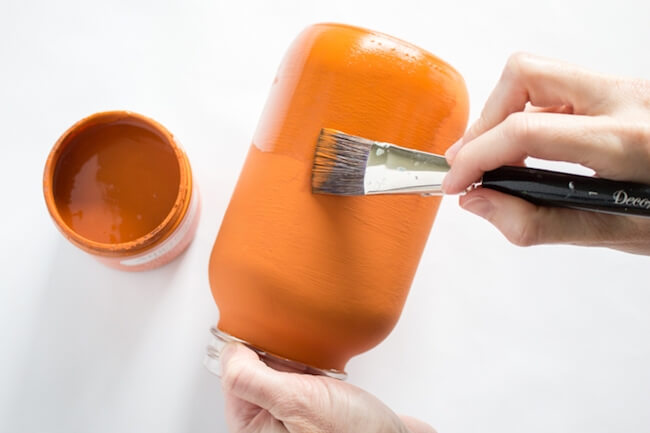Painting mason jar pumpkins