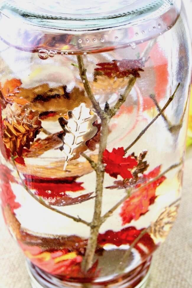 Mix with a spoon then add a bunch of the confetti to the jar. Swirl around with a spoon and if the confetti immediately sinks to the bottom then add a bit more glycerin. The glycerin is what makes the leaves fall slowly.