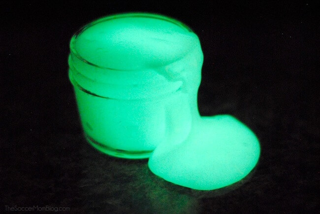 glowing slime in the dark oozing in a jar