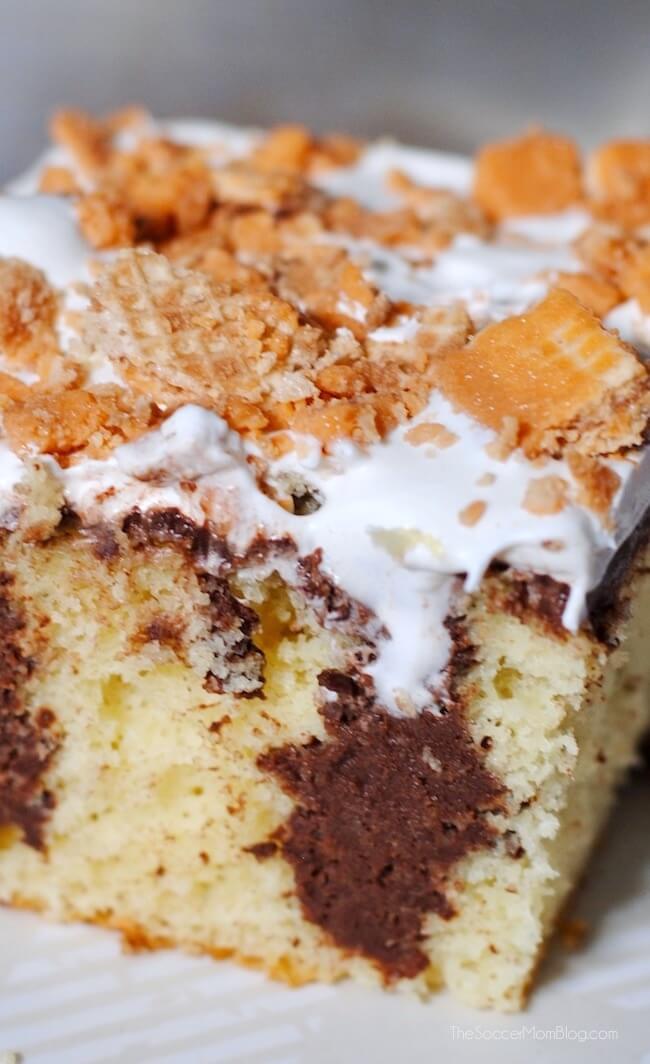 WOW! Rich butter cake infused with dark chocolate and topped with luscious whipped cream and special Pumpkin Pie Kit Kat bars. It's amazing!!