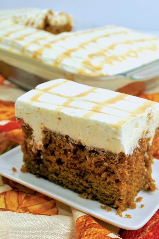 The perfect poke cake! This dreamy pumpkin poke cake is soaked with rich caramel and topped with a fluffy whipped cream cheese frosting.