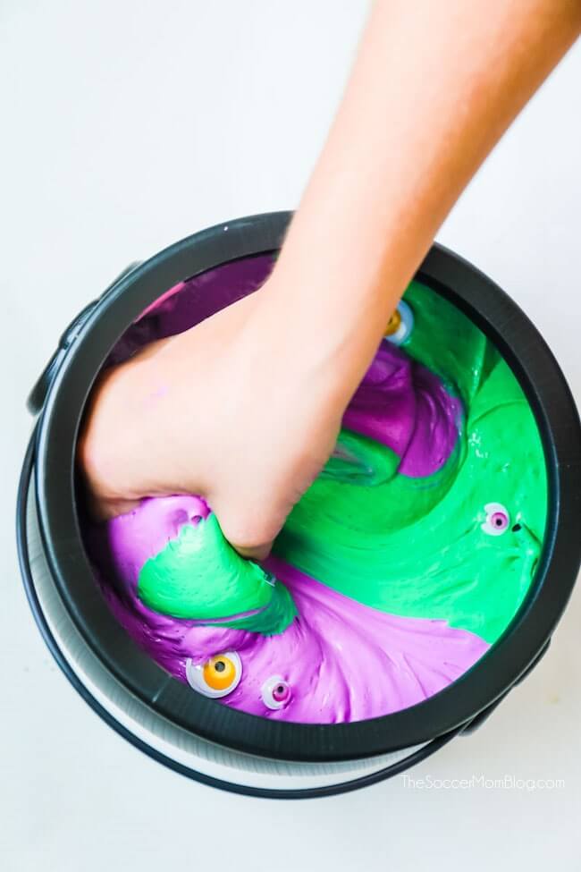 Creepy cool!! This witches brew Halloween slime is super stretchy fluffy slime filled with monster eyes.
