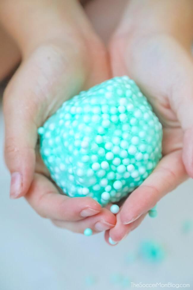 hands holding a ball of floam