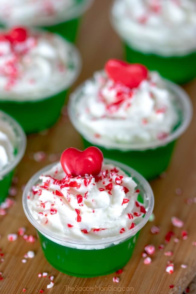 Grinch Jello Shots - with whipped cream and a heart sprinkle