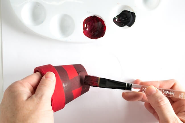 Buffalo Plaid Painted Pots are a gorgeous holiday decoration or handmade Christmas gift idea! Click for video tutorial & photo step-by-step instructions.