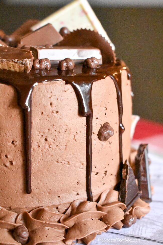 The most over-the-top decadent dessert ever!! This Candy Bar Cake is a chocolate lover's dream come true! Click for recipe!
