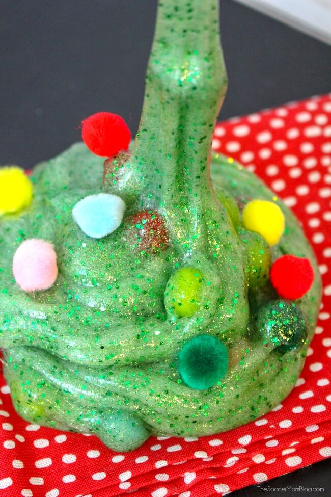 Celebrate the holidays with this lovely scented Christmas tree slime with pom pom ornaments!