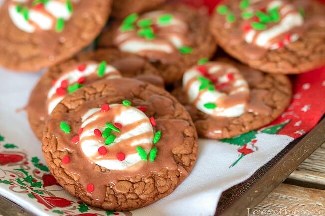 chocolate cookies with melted marshmallow center and red and green sprinkles