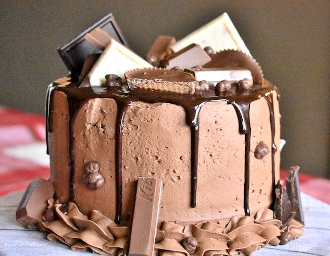 The most over-the-top decadent dessert ever!! This Candy Bar Cake is a chocolate lover's dream come true!