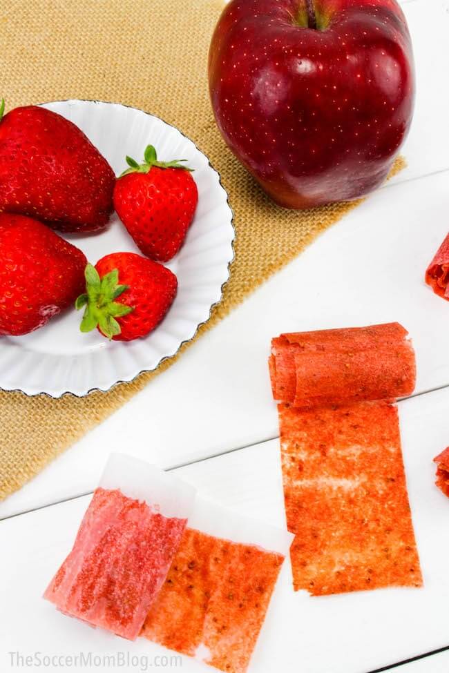 homemade fruit rolls ups with fresh strawberries and apples