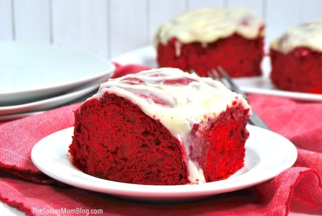 Our absolutely decadent Red Velvet Cinnamon Rolls are surprisingly easy to make with this box cake shortcut!
