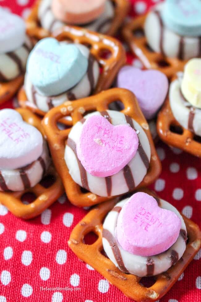 A quick and easy Valentine's Day party snack that's ready in minutes! These cute Valentine Pretzel Treats are fun for kids to make and perfect gifts for teachers, family and friends.