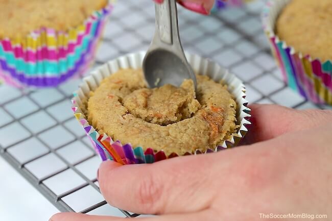 hollowing out a cupcake with a spoon