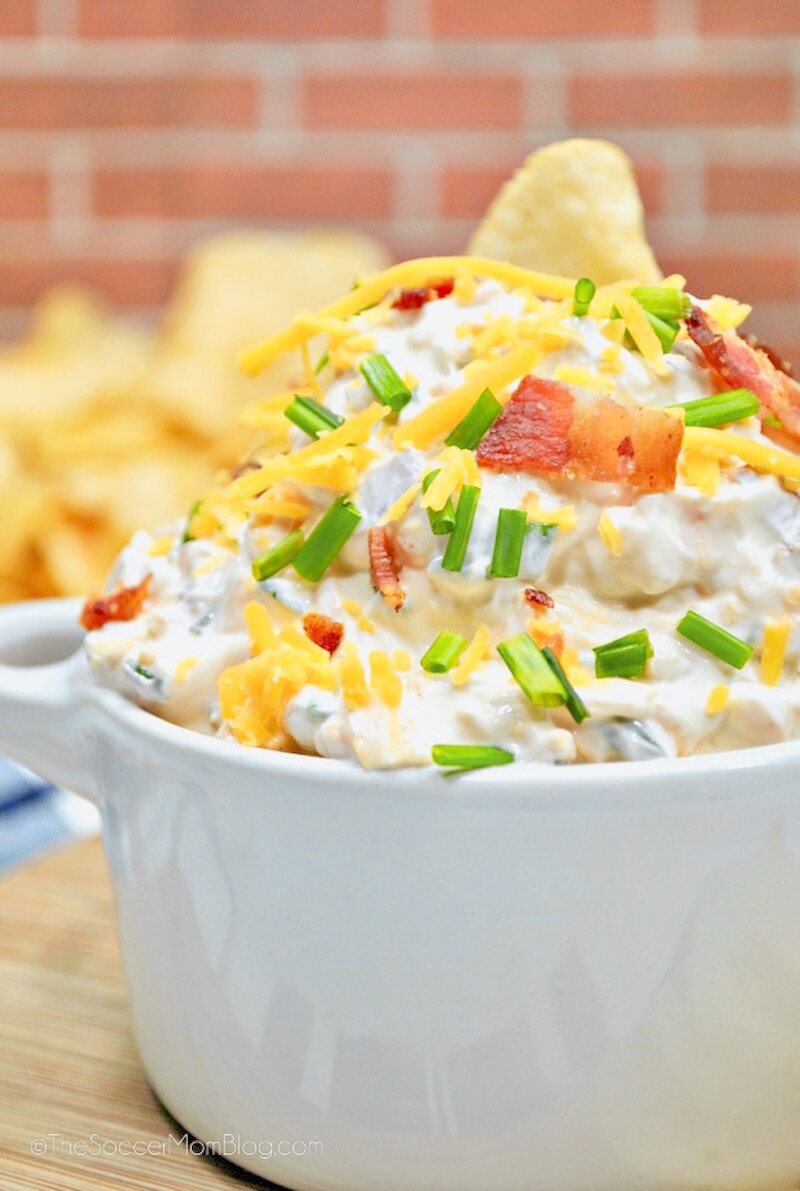 close up of a loaded baked potato dip in bowl