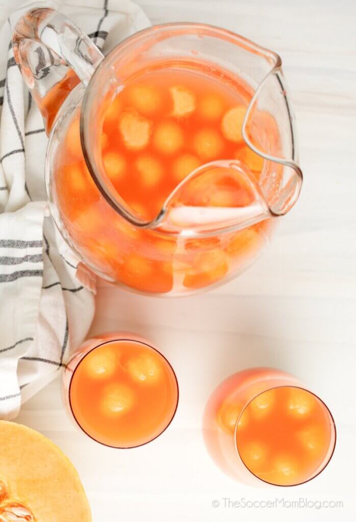 pitcher of rum punch with melon balls