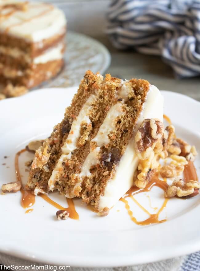 close up of a slice of carrot cake on a white plate