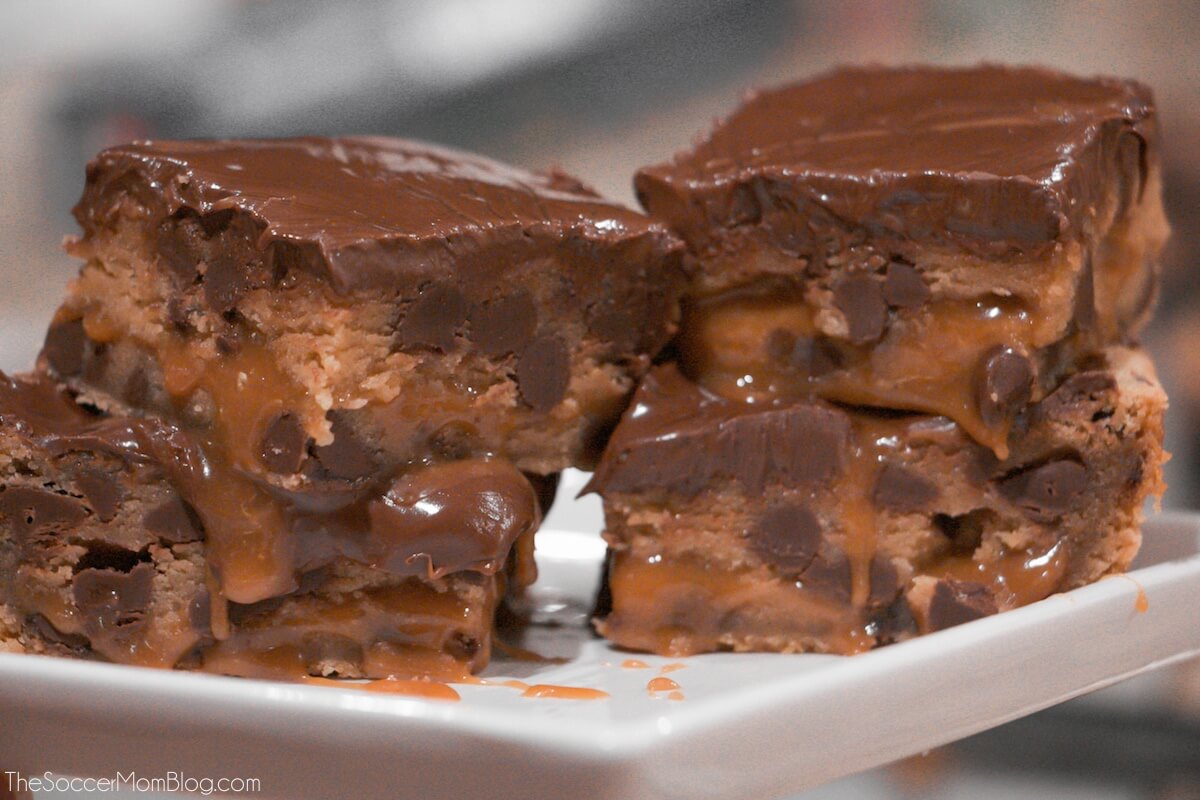 stacks of gooey caramel filled chocolate chip cookie bars