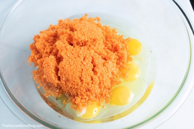 pureed carrots and eggs in a glass mixing bowl