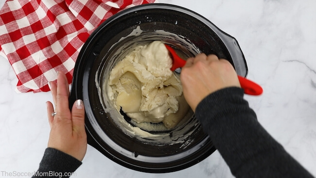 stirring play dough in slow cooker
