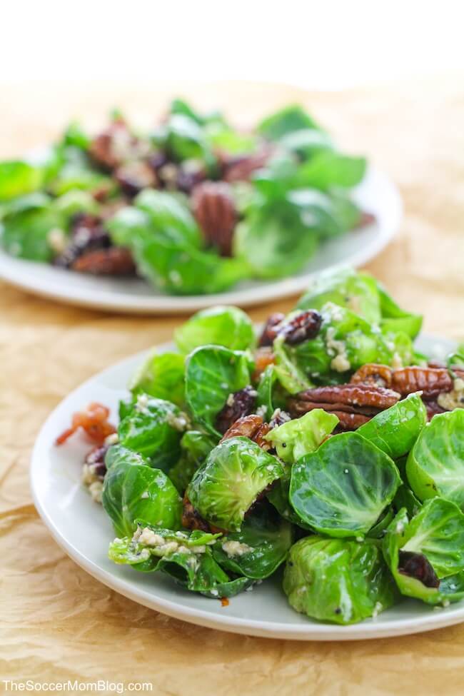 Fresh, crispy, sweet, and savory, this Brussels Sprout Salad with Bacon is miles above other salads! And the sweet Poppyseed Vinaigrette is absolutely amazing! The best part is that you can whip up this delicious bacon and Brussel sprout salad in just a few minutes!