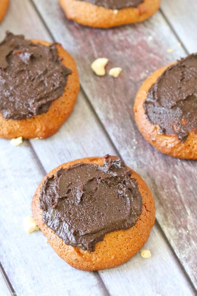 golden brown cashew butter cookies with cacao frosting