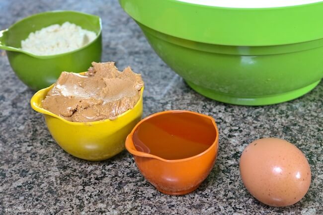 ingredients to make cashew butter cookies in measuring cups