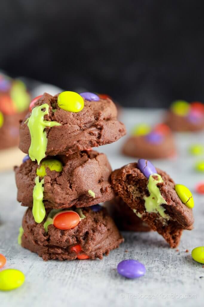 stack of Halloween cookies with oozing green frosting