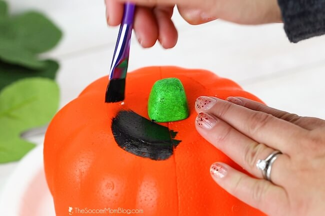 painting a craft foam pumpkin black