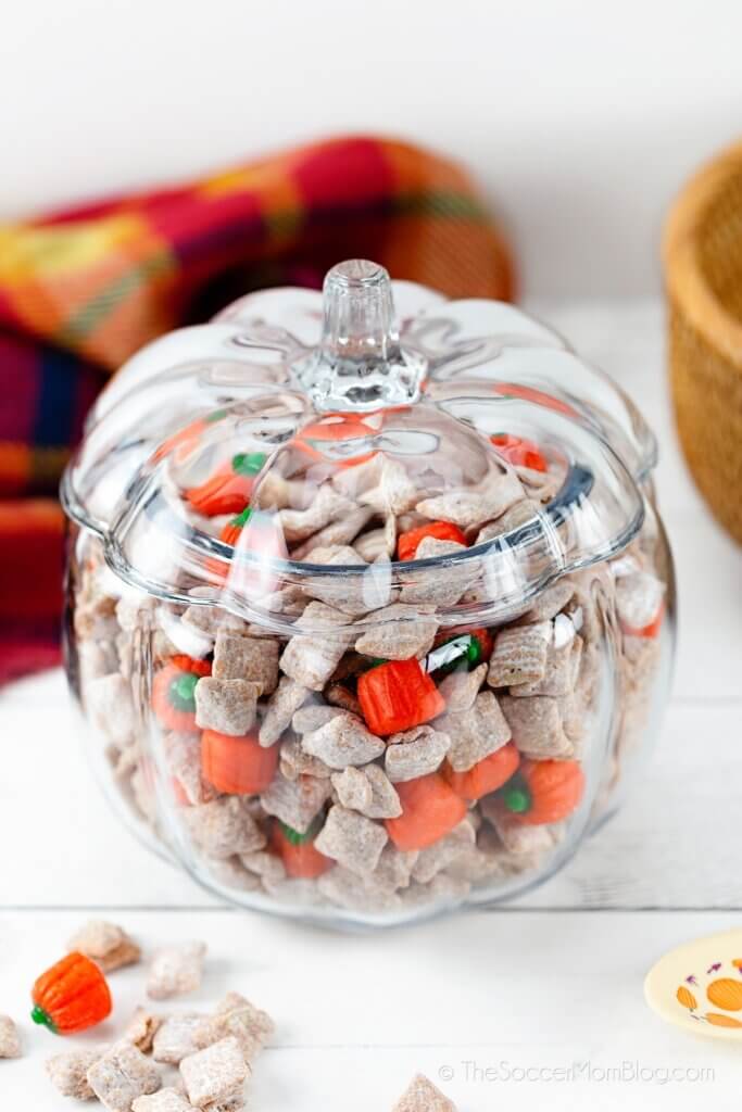 glass pumpkin filled with fall snack mix