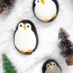 These adorable Penguin Painted Rocks make perfect winter decor for your home!