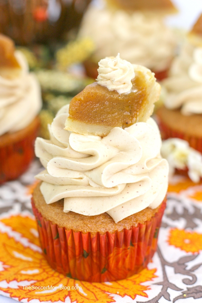 pumpkin pie cupcakes topped with a miniature slice of pumpkin pie