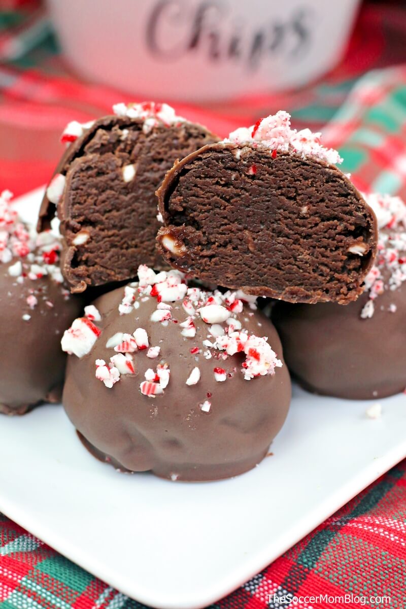Rich fudge brownies coated in milk chocolate and crushed candy canes, these peppermint brownie truffles are the ultimate holiday indulgence!