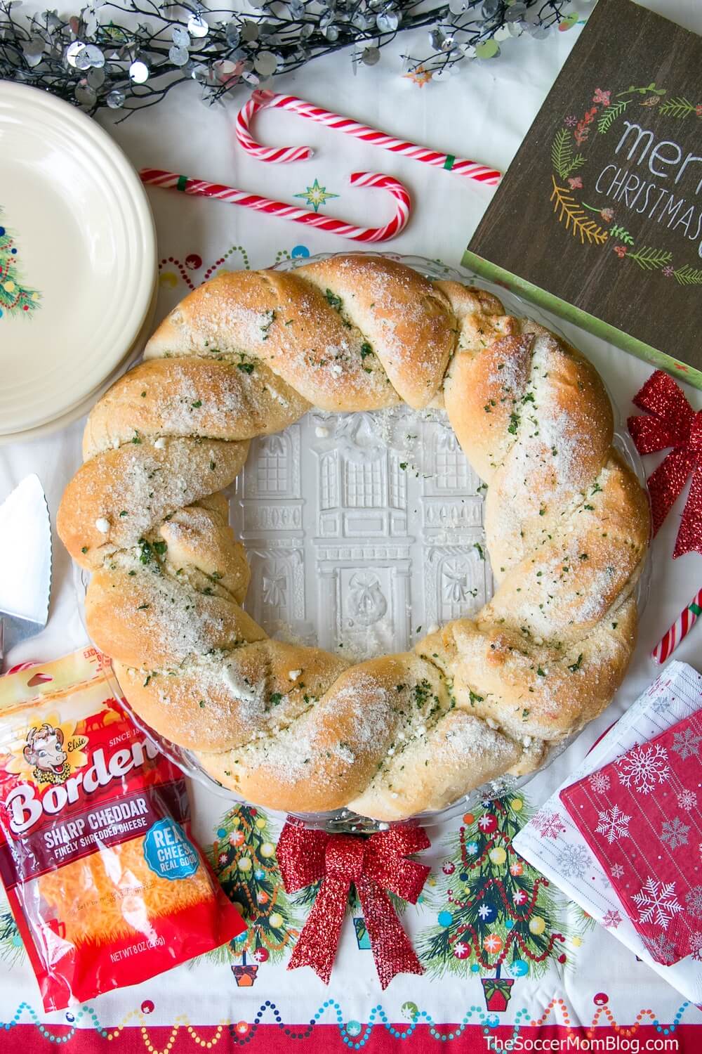 A festive holiday appetizer that's bursting with warm cheesy goodness, this Cheesy Pull Apart Bread Wreath will be the hit of every Christmas party! Sponsored by Borden® Cheese.