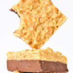 Close up of a square of German chocolate fudge with a bite missing