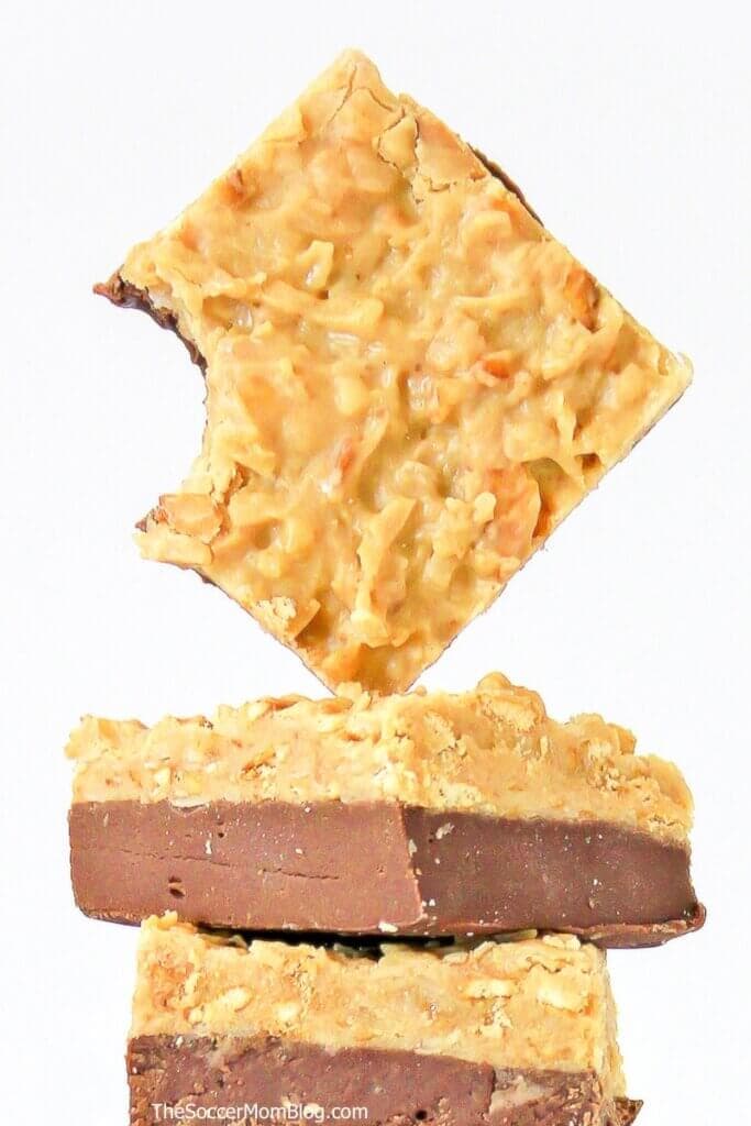 Close up of a square of German chocolate fudge with a bite missing