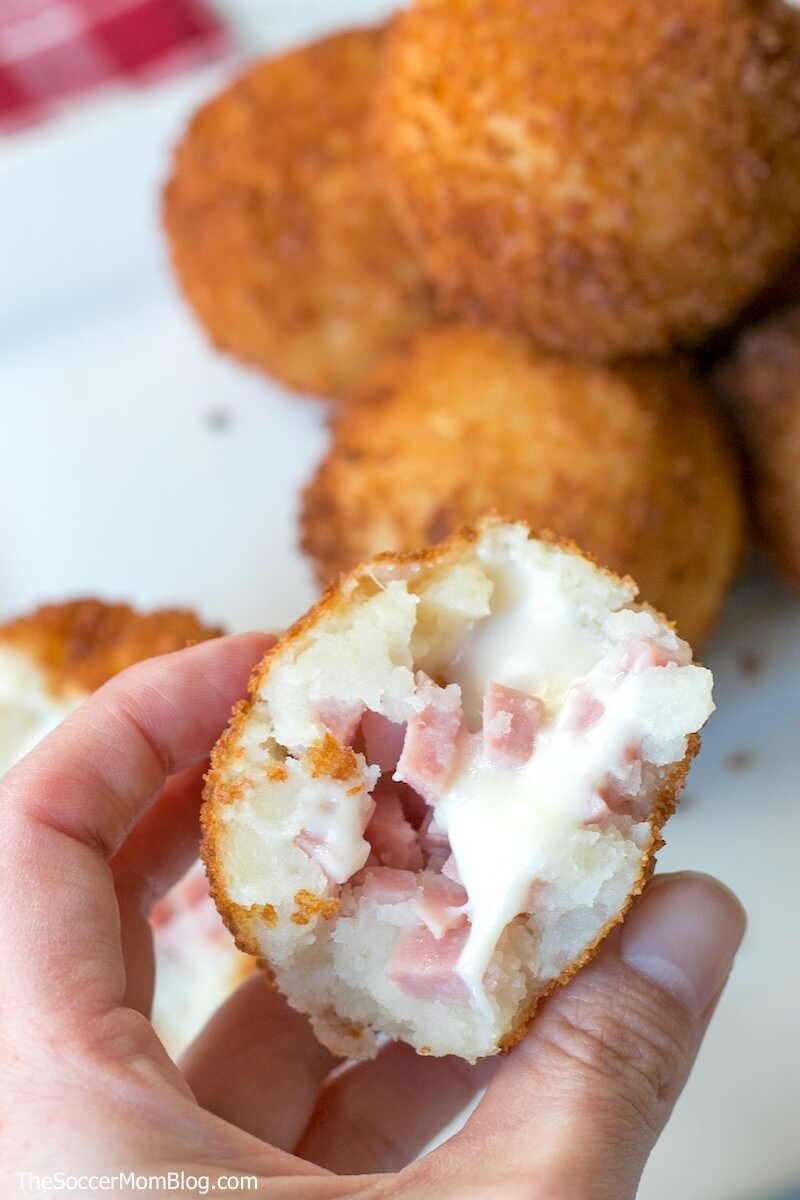 close up of the inside of a melty ham and cheese croquette