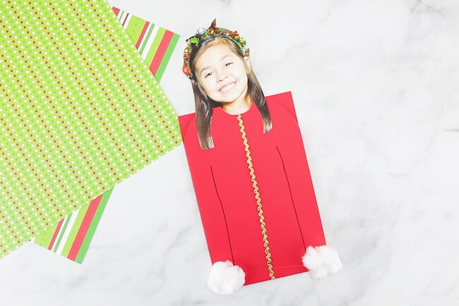 It may be called "ugly" but this Ugly Sweater Christmas Card is one of the CUTEST kid-made Christmas card ideas ever! And it's super easy to make!
