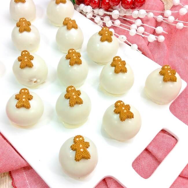 white chocolate truffle balls with gingerbread men decorations