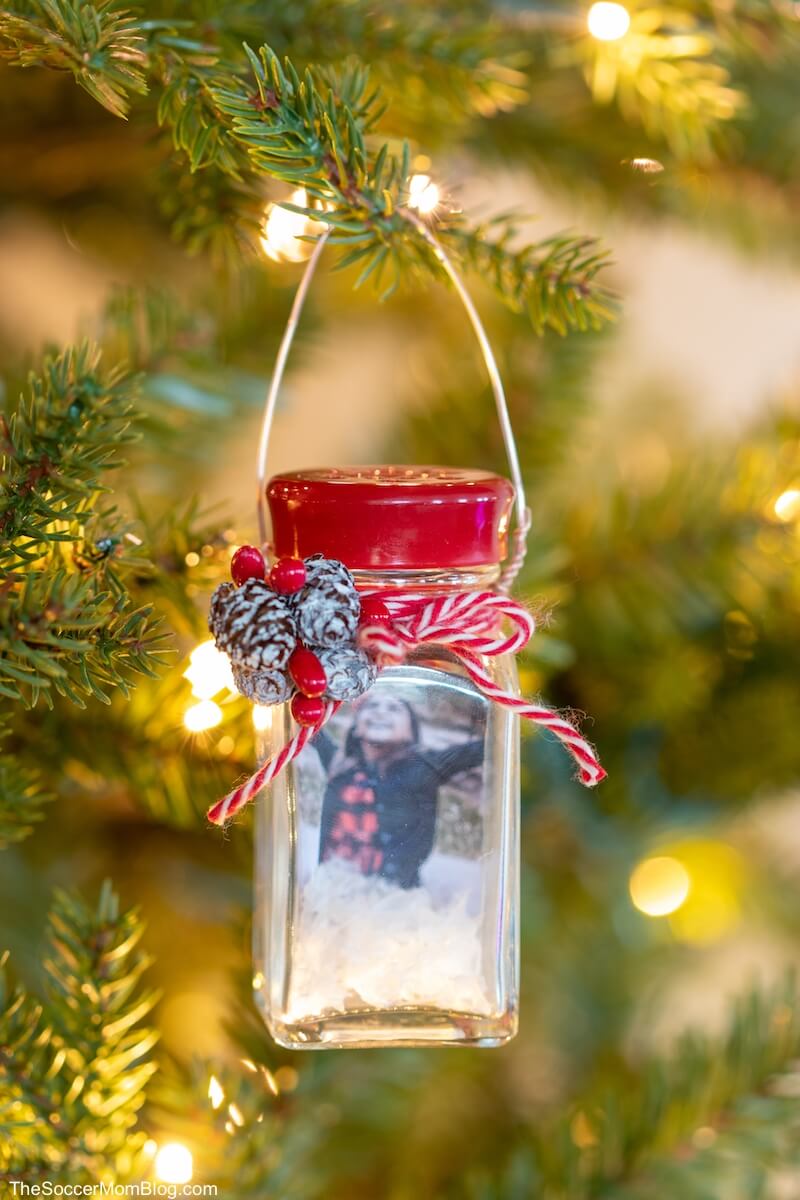 snow globe ornament made from a salt shaker hanging on Christmas tree