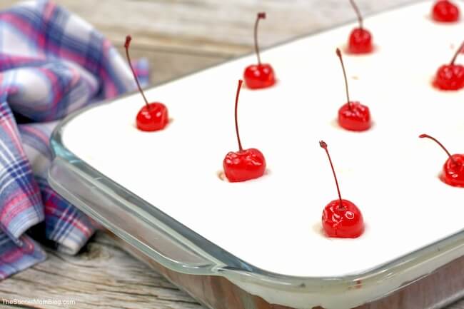 Cherry Dump Cake in pan with cherries on top